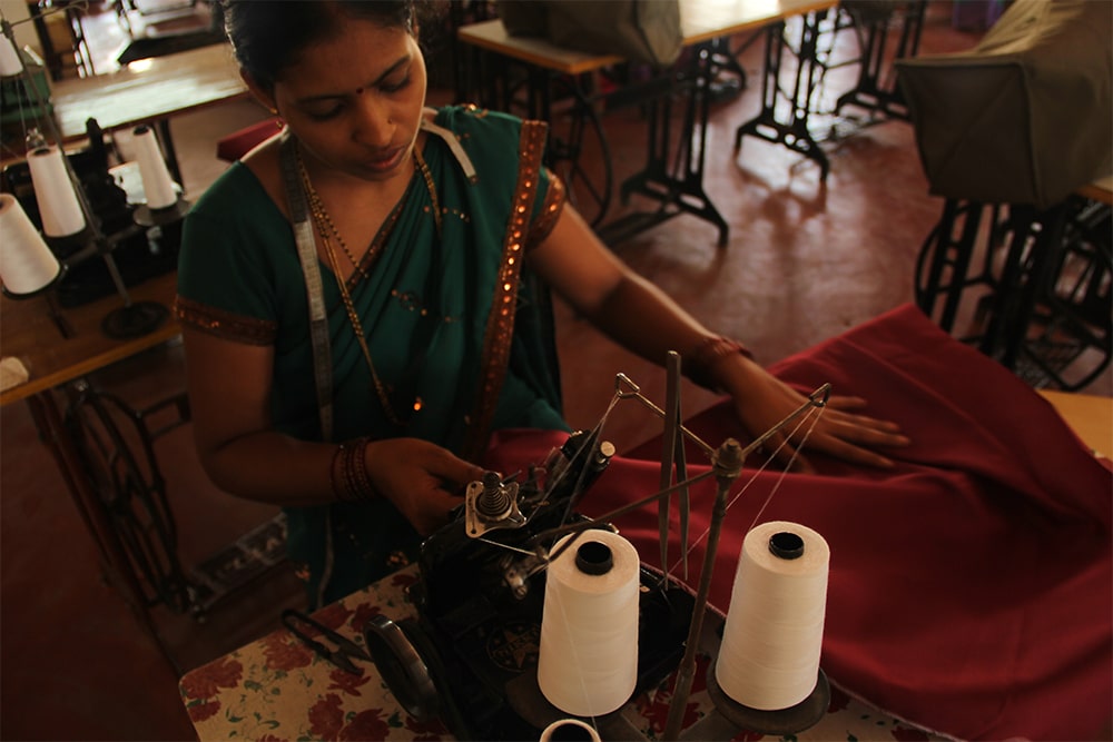 Fabric--Unit---working-woman-stitching